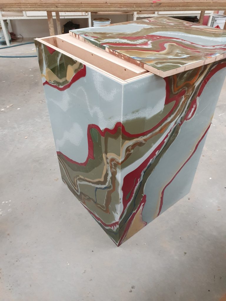 Custom-made display plinth with multi-coloured resin finish crafted by Newton Gordge Joinery in Taranaki.