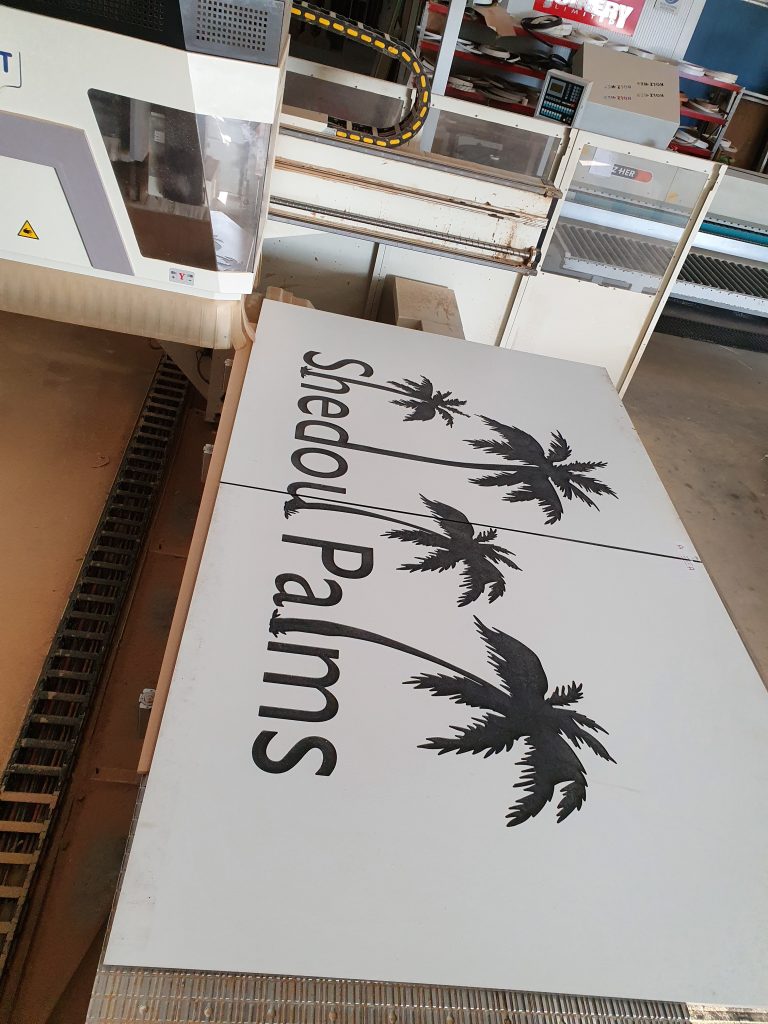 Custom CNC-carved timber signage with detailed lettering produced by Newton Gordge Joinery.