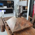 Custom retirement trophy featuring an industrial drill bit mounted on a handcrafted timber plinth made by Newton Gordge Joinery.