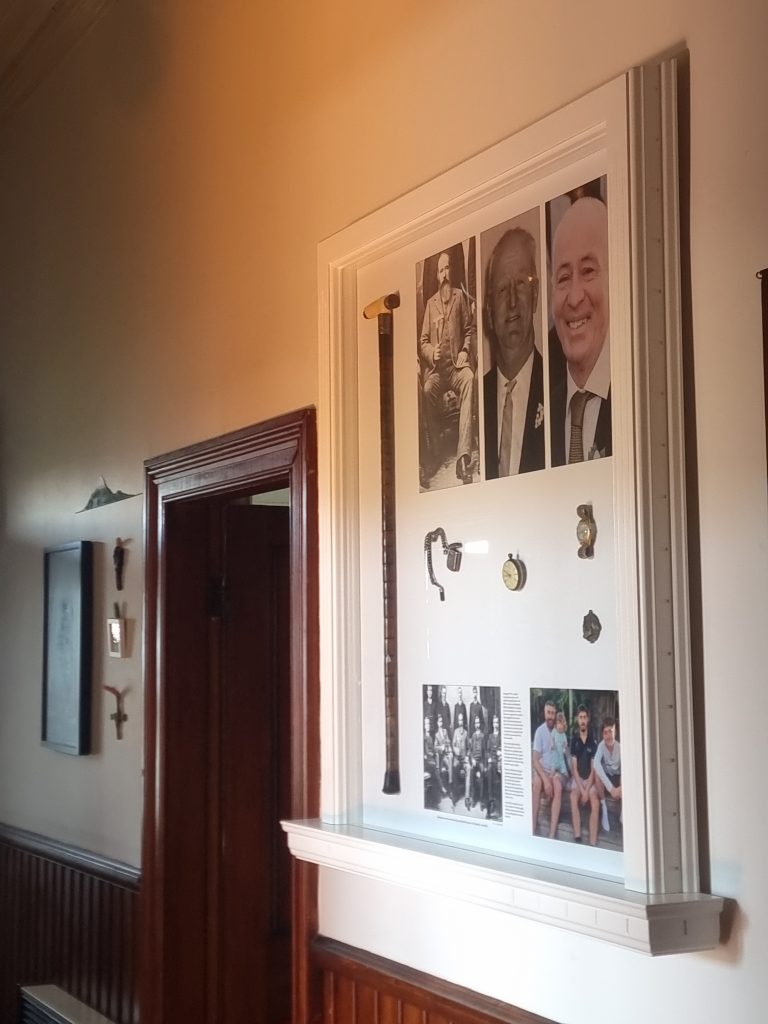 Custom timber display frame with integrated shelving and detailed mouldings, handcrafted by Newton Gordge Joinery.