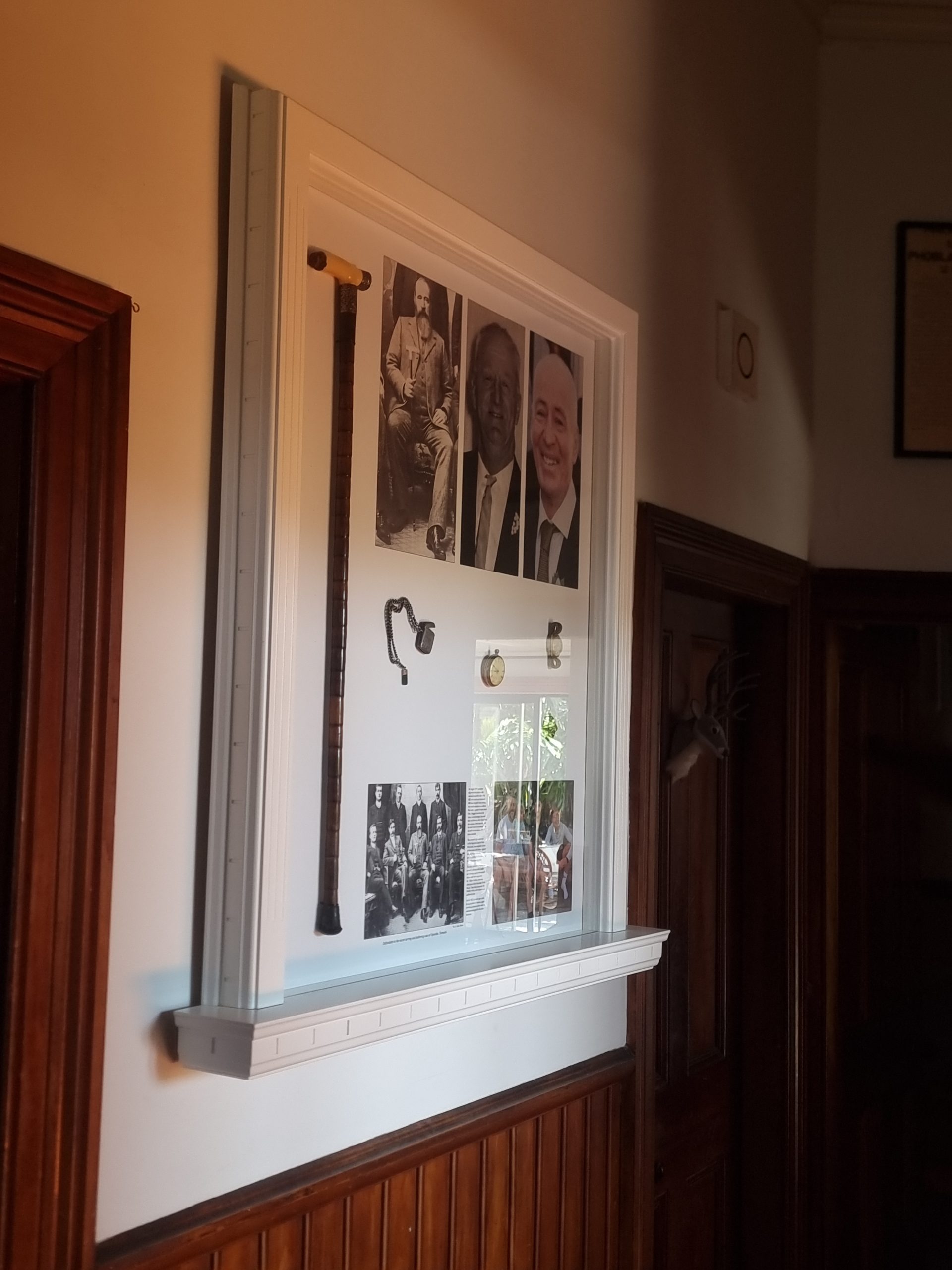 Custom timber display frame with integrated shelving and detailed mouldings, handcrafted by Newton Gordge Joinery.