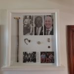 Custom timber display frame with integrated shelving and detailed mouldings, handcrafted by Newton Gordge Joinery.