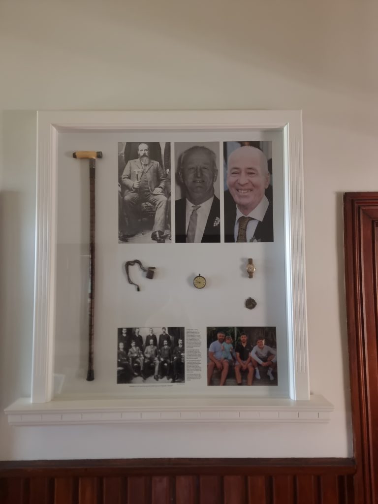 Custom timber display frame with integrated shelving and detailed mouldings, handcrafted by Newton Gordge Joinery.