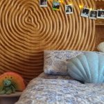 Custom CNC-carved timber bedhead with layered contour design crafted by Newton Gordge Joinery.